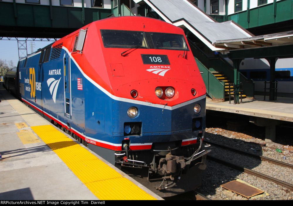 AMTK 108 leading train 290 in perfect light.